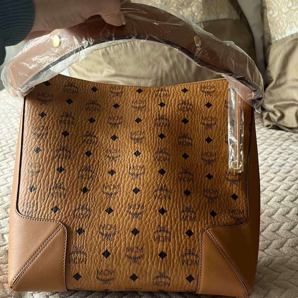 Brand new MCM cognac color shoulder women’s purse with tags and dust case
